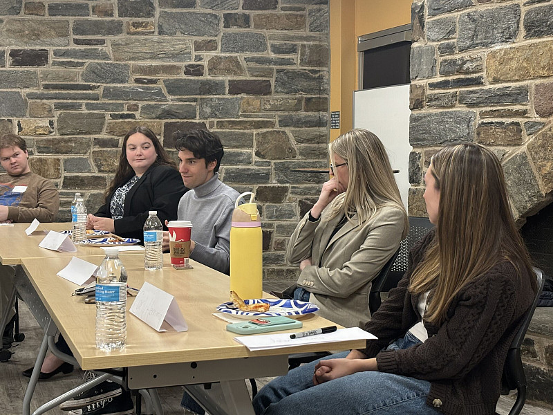 Trial Attorney Dr. Karla Payonk '17 and students from the pre-law program discussing internships, law school opportunities, early career pre