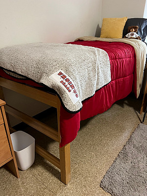 Bed height can go as high as 35-36 without separate bed risers. To be safe, storage furnishings should be roughly 33-24 max height.