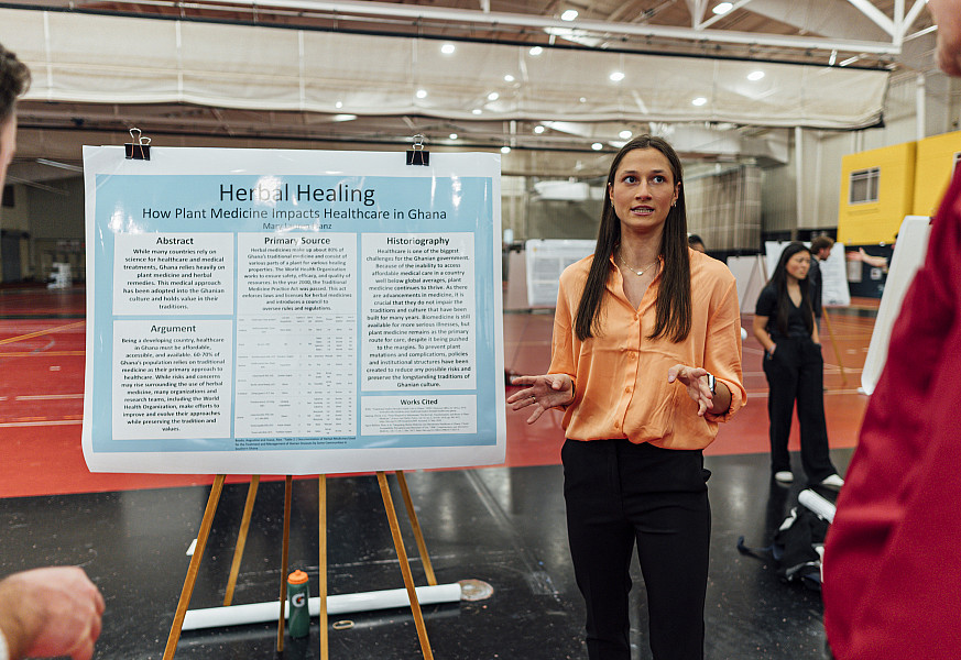 Mary Franz presenting research to others in 2024.