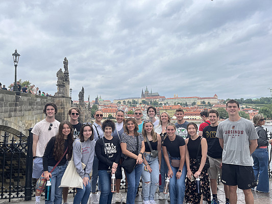 Exploring history on the iconic Charles Bridge, the group took in the stunning views of the capital city, including the Prague Castle.