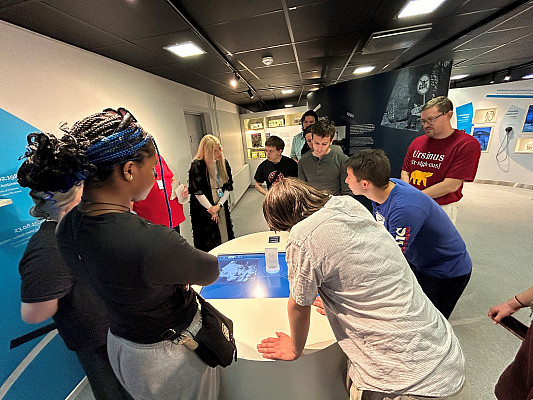 APEX Economies in Transition Study Abroad Students reviewing a table screen