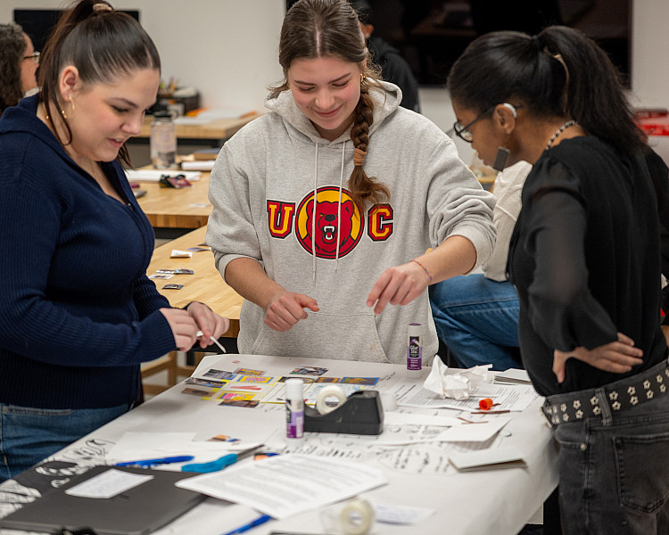 Students collaborate to create one-pagers to present their experience on the final day of Experiential Learning Week.