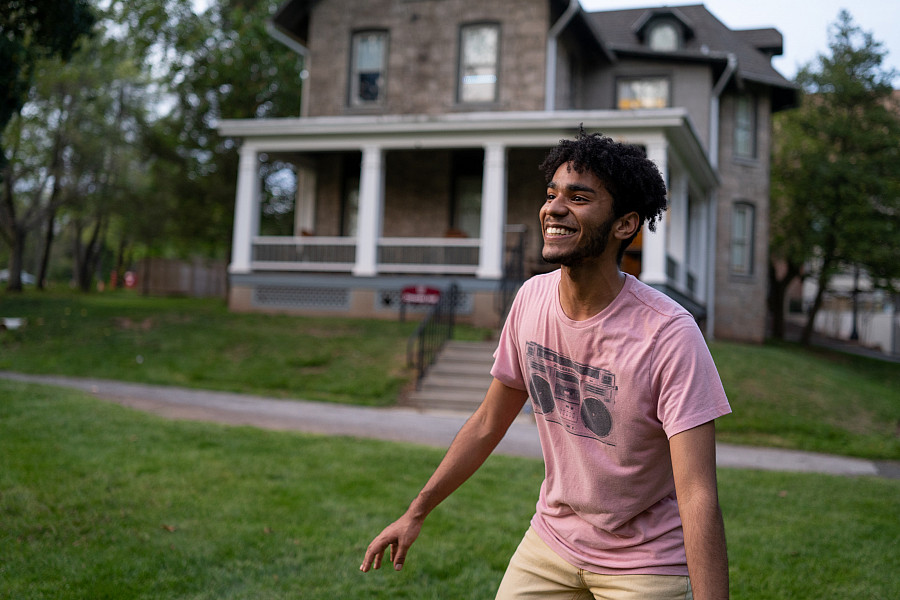Student playing frisbee on Omwake Hall lawn. Ursinus has over 22+ active Main Street residential houses for upperclassmen.