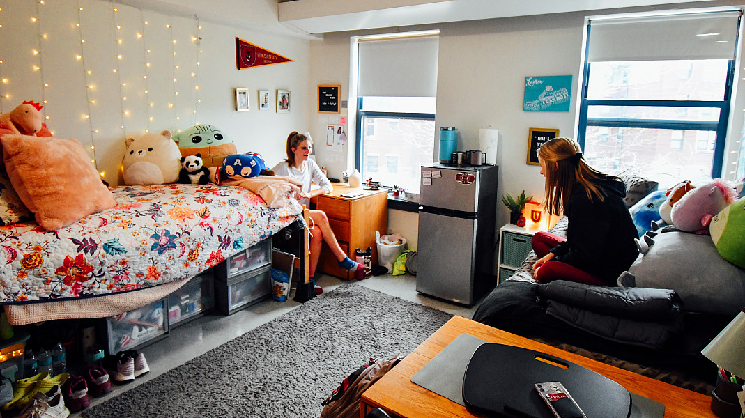 Students hanging out in a traditional double residential room.