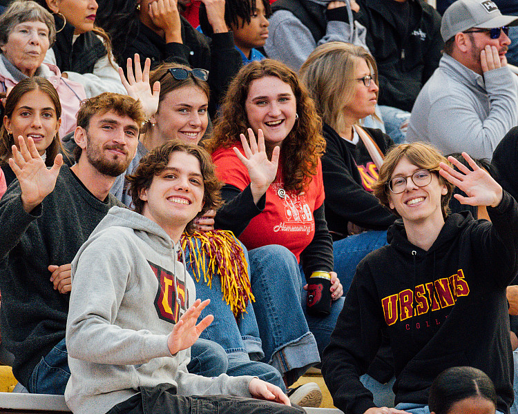 students in stands of football games- Cheer on your Bears!