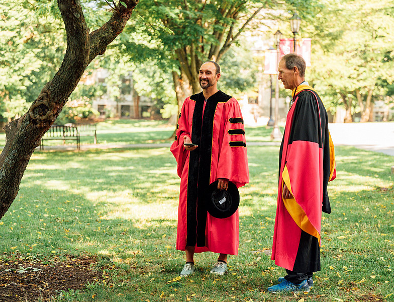 Faculty prepping for annual commencement walk across campus.