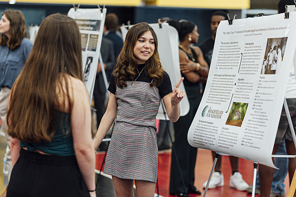 History student presents their research findings in Floy Lewis Bakes Center. Part of CoSA 2024 | April 24, 2024